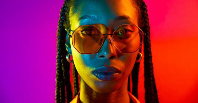 Beautiful afro-american woman with afro pigtails hairstyle and stylish clothes - Portrait of young black girl in studio - DMDF03815