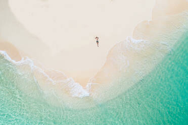 Daku Island, Siargao, Philippines - Tropical beach with blue water and palm trees - DMDF03824