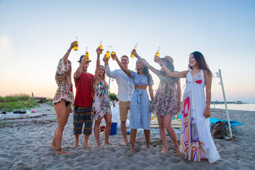 Happy group of friends celebrating and having fun on the beach - Young people on summer holiday - DMDF04051