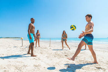 Group of friends having fun on the beach - Young and happy tourists bonding outdoors, enjoying summertime - DMDF04104