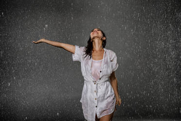 Woman having fun under the rain - DMDF04209
