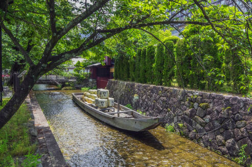 Japan, Kyoto Prefecture, Kyoto City, Rowboat in Kamo river in summer - THAF03216