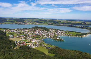 Austria, Salzburger Land, Mattsee, Drone view of rural town and surrounding lake in summer - WWF06318