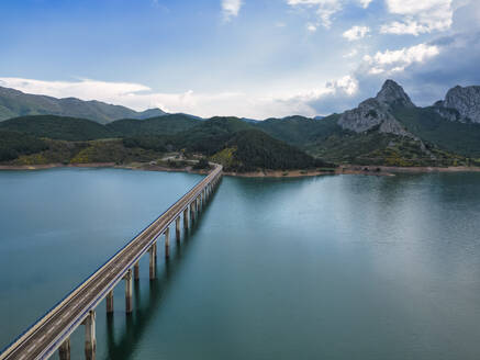 Spain, Asturias, Riano, Aerial view of bridge stretching over Embalse de Riano reservoir - LAF02827