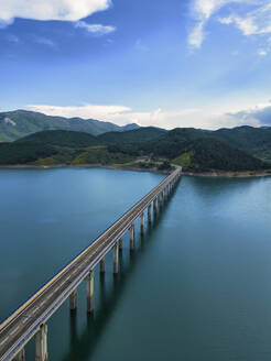 Spain, Asturias, Riano, Aerial view of bridge stretching over Embalse de Riano reservoir - LAF02828