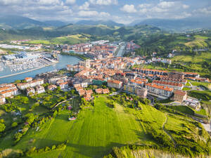 Spain, Basque Country, Zumaia, Aerial view of town on Atlantic coast in summer - LAF02833