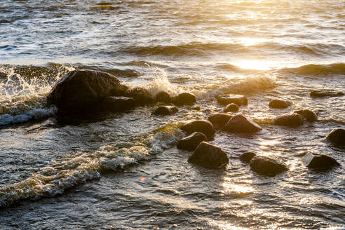 Germany, Mecklenburg-Vorpommern, Coastal rocks at sunset - EGBF00902