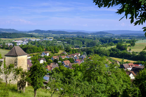 Germany, Baden-Wurttemberg, Aach, Green trees in front of village in Hegau - LBF03859