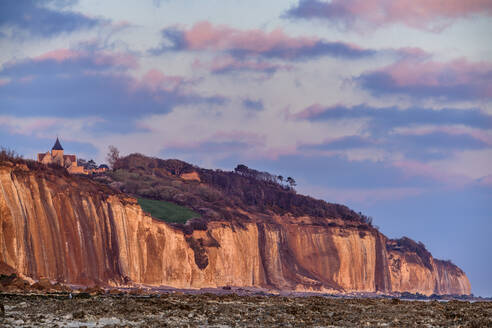 Chalk cliffs under cloudy sky at sunrise - ANSF00569