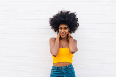 Happy african american woman smiling. Beautiful young female walking and having fun in New York city - DMDF04779