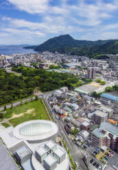 Japan, Oita Prefecture, Beppu, Aerial view of city on Kyushu island - THAF03228