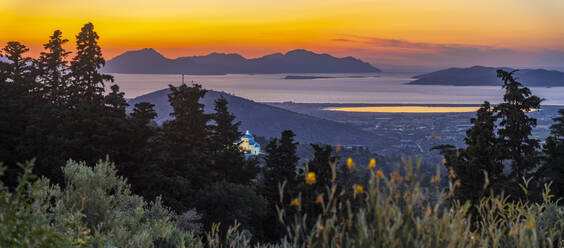 View of Kos Island and Greek Orthodox church from Zia Sunset View at sunset, Zia Village, Kos Town, Kos, Dodecanese, Greek Islands, Greece, Europe - RHPLF27304