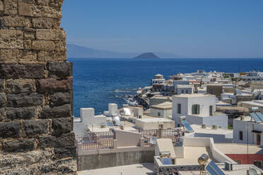 View of sea and whitewashed buildings and rooftops of Mandraki, Mandraki, Nisyros, Dodecanese, Greek Islands, Greece, Europe - RHPLF27310
