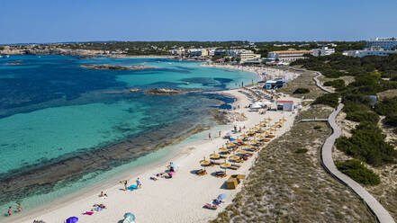 Aerial of the turquoise waters and white sand beach of the Pujols beach, Formentera, Balearic Islands, Spain, Mediterranean, Europe - RHPLF27367