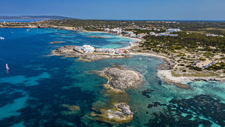 Aerial of the turquoise waters and white sand beach of the Pujols beach, Formentera, Balearic Islands, Spain, Mediterranean, Europe - RHPLF27370