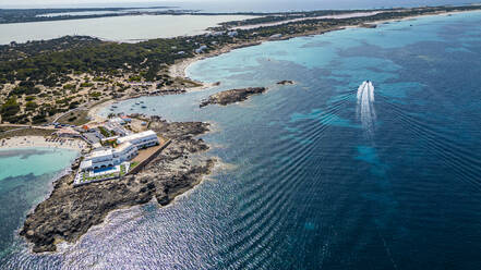 Aerial of the turquoise waters and white sand beach of the Pujols beach, Formentera, Balearic Islands, Spain, Mediterranean, Europe - RHPLF27375