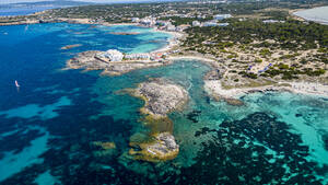 Aerial of the turquoise waters and white sand beach of the Pujols beach, Formentera, Balearic Islands, Spain, Mediterranean, Europe - RHPLF27376