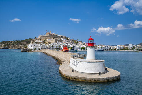 Harbour lighthouse and the old town of Ibiza with its castle seen from the harbor, UNESCO World Heritage Site, Ibiza, Balearic Islands, Spain, Mediterranean, Europe - RHPLF27382
