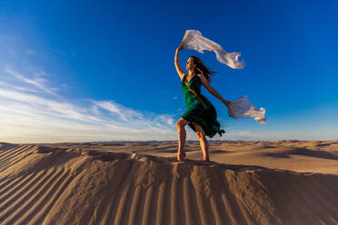 Ethereal woman at the Imperial Sand Dunes, California, United States of America, North America - RHPLF27472