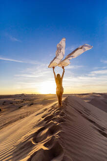 Ethereal woman at the Imperial Sand Dunes, California, United States of America, North America - RHPLF27474