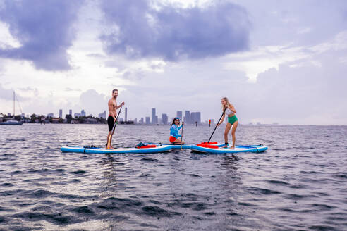 Paddleboarding off Miami Beach, Florida, United States of America, North America - RHPLF27475