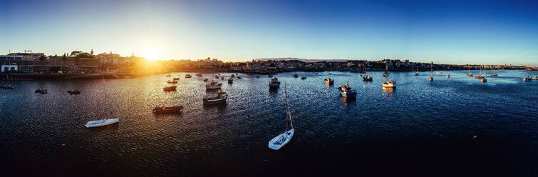 Aerial drone panoramic view of sunset at Cascais Bay, in the Lisbon region of the Portuguese Riveira, Europe - RHPLF27477