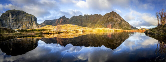 Panoramic of mountains reflected in the calm waters of a fjord at dawn, A i Lofoten, Moskenes, Lofoten Islands, Nordland, Norway, Scandinavia, Europe - RHPLF27582