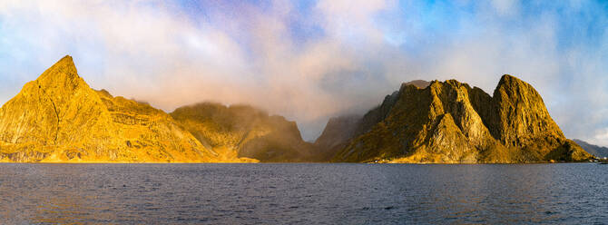 Panoramic of Olstind and Festhelltinden mountains in the mist at dawn, Reine, Lofoten Islands, Nordland, Norway, Scandinavia, Europe - RHPLF27607