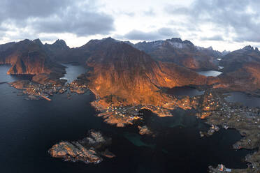 Panoramic aerial view of mountains surrounding the coastal villages of Tind and A i Lofoten, Lofoten Islands, Nordland, Norway, Scandinavia, Europe - RHPLF27611