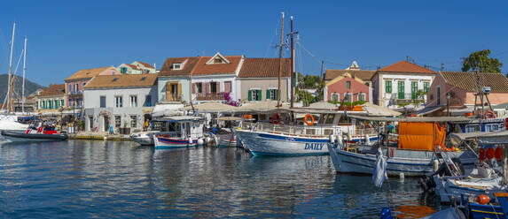 View of cafes and shops in Fiscardo harbour, Fiscardo, Kefalonia, Ionian Islands, Greek Islands, Greece, Europe - RHPLF27878