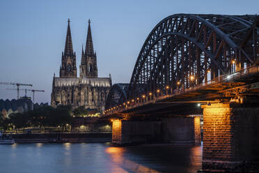 Cologne Cathedral, UNESCO World Heritage Site, and Hohenzollern Bridge at dusk, Cologne, North Rhine-Westphalia, Germany, Europe - RHPLF27896