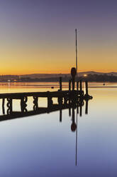 A very calm dusk scene, with a wooden jetty on the estuary of the River Teign, at Coombe Cellars, near Newton Abbot, south coast of Devon, England, United Kingdom, Europe - RHPLF27916