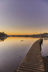 A very calm dusk scene, with a wooden jetty on the estuary of the River Teign, at Coombe Cellars, near Newton Abbot, south coast of Devon, England, United Kingdom, Europe - RHPLF27918