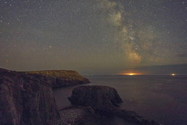 An autumn view of the Milky Way over the Atlantic Ocean, seen from the cliffs of Land's End, the most southwesterly point of Great Britain, Cornwall, England, United Kingdom, Europe - RHPLF27928