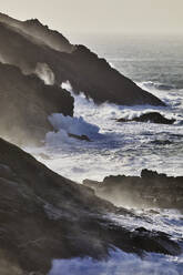 Atlantic cliffs pounded by surf and spray during stormy winter weather, at Pendeen, near S.t Just, in the far west of Cornwall, England, United Kingdom, Europe - RHPLF27936