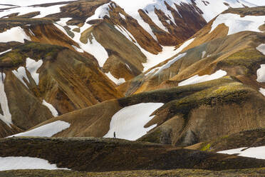 A person enjoy the beautiful landscape in Landmannalaugar mountain on a summer day, Iceland, Polar Regions - RHPLF28002