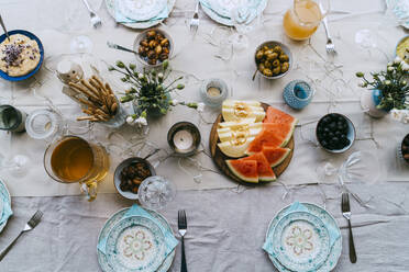 Directly above shot of fresh fruits and drinks arranged on table - MASF38924