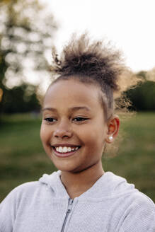 Happy girl smiling in playground - MASF39536