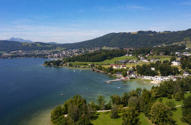 Austria, Upper Austria, Altmunster, Drone panorama of town on shore of Traunsee lake in summer - WWF06397