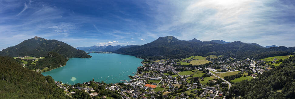 Austria, Upper Austria, Sankt Gilgen, Drone panorama of Lake Wolfgangsee and surrounding town in summer - WWF06405