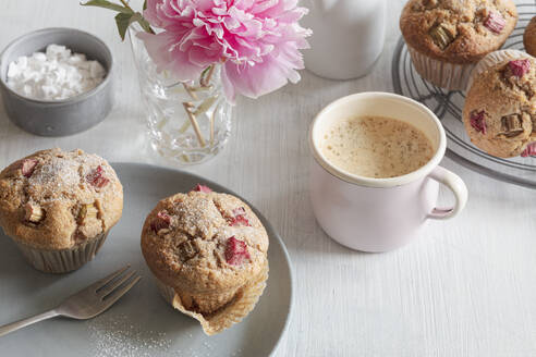 Studio shot of cup of coffee and rhubarb muffins - EVGF04383