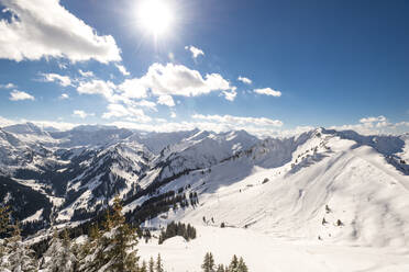Austria, Vorarlberg, Sun shining over snowcapped peaks of Allgau Alps - EGBF00958