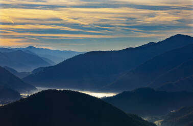 Austria, Salzburger Land, Ebenau, Foggy valley in Salzkammergut mountains at dawn - WWF06471