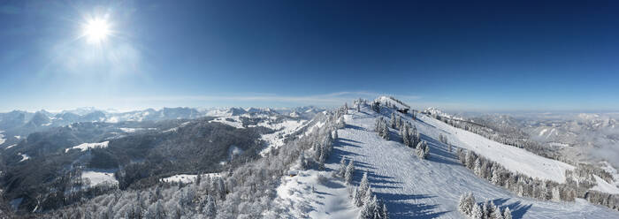 Austria, Salzburger Land, Saint Gilgen, Drone panorama of snowcapped Zwolferhorn mountain and surrounding landscape - WWF06487