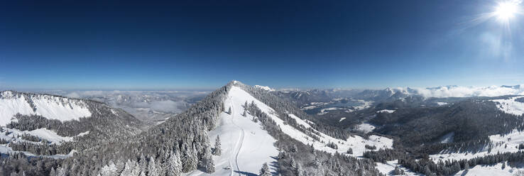 Austria, Salzburger Land, Saint Gilgen, Drone panorama of snowcapped Zwolferhorn mountain and surrounding landscape - WWF06493