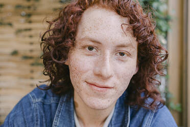 Smiling young redhead man with Freckles on face - DSIF00697