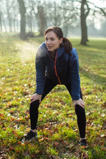 Woman Resting After Morning Exercise With In Winter Park - INGF12094