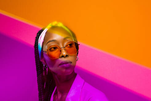 Beautiful afro-american woman with afro pigtails hairstyle and stylish clothes - Portrait of young black girl in studio - DMDF04896