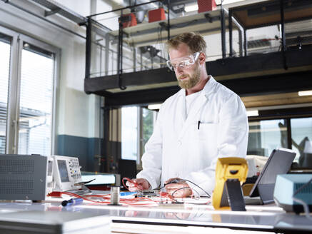 Scientist working on circuit board in laboratory - CVF02481