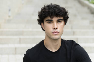Serious young man with black hair - LMCF00558